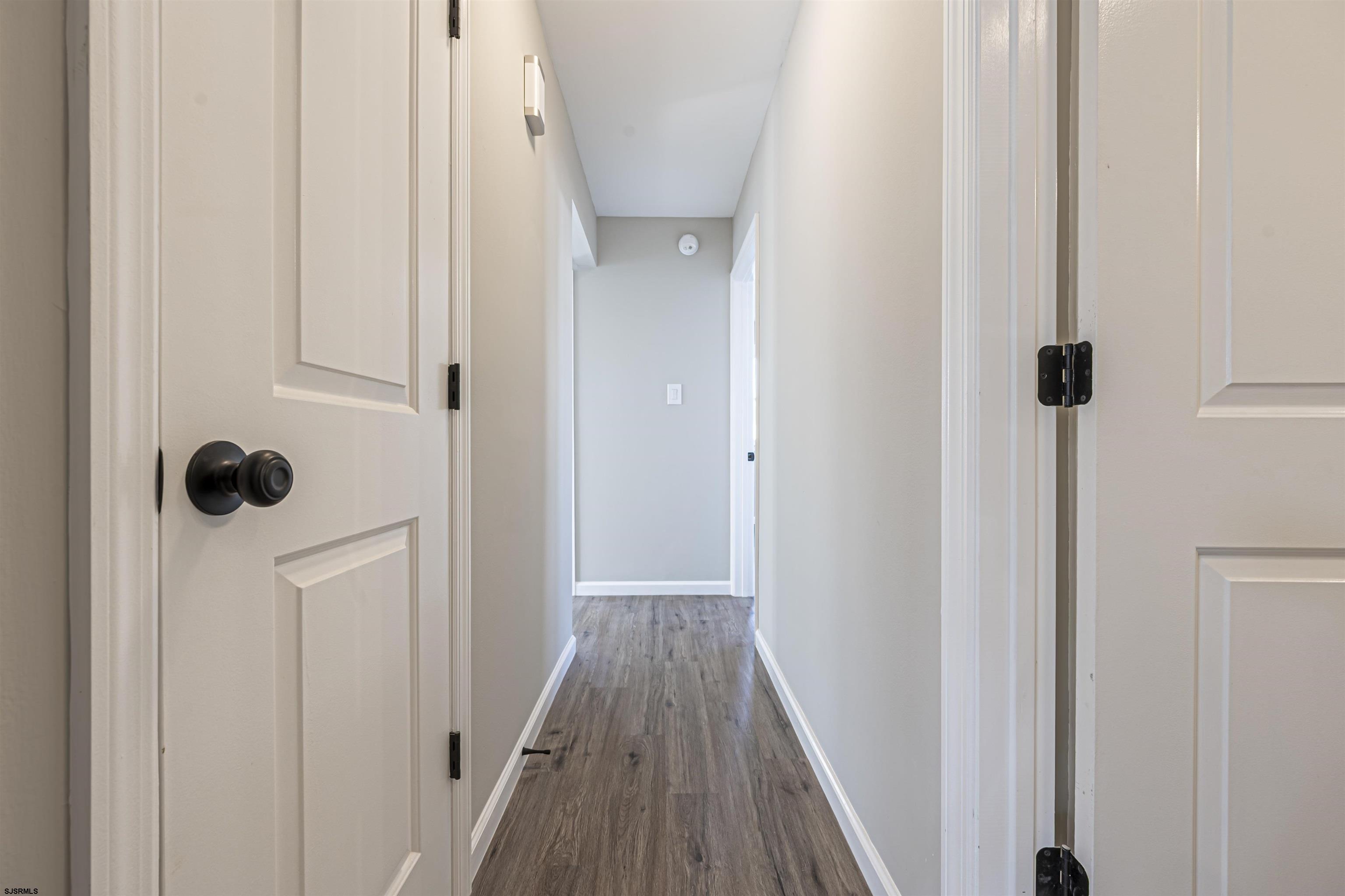 4617 Schooner Road, Unit A Brigantine, NJ 08203 - Photo 17 of 31 a view of a hallway with wooden floor