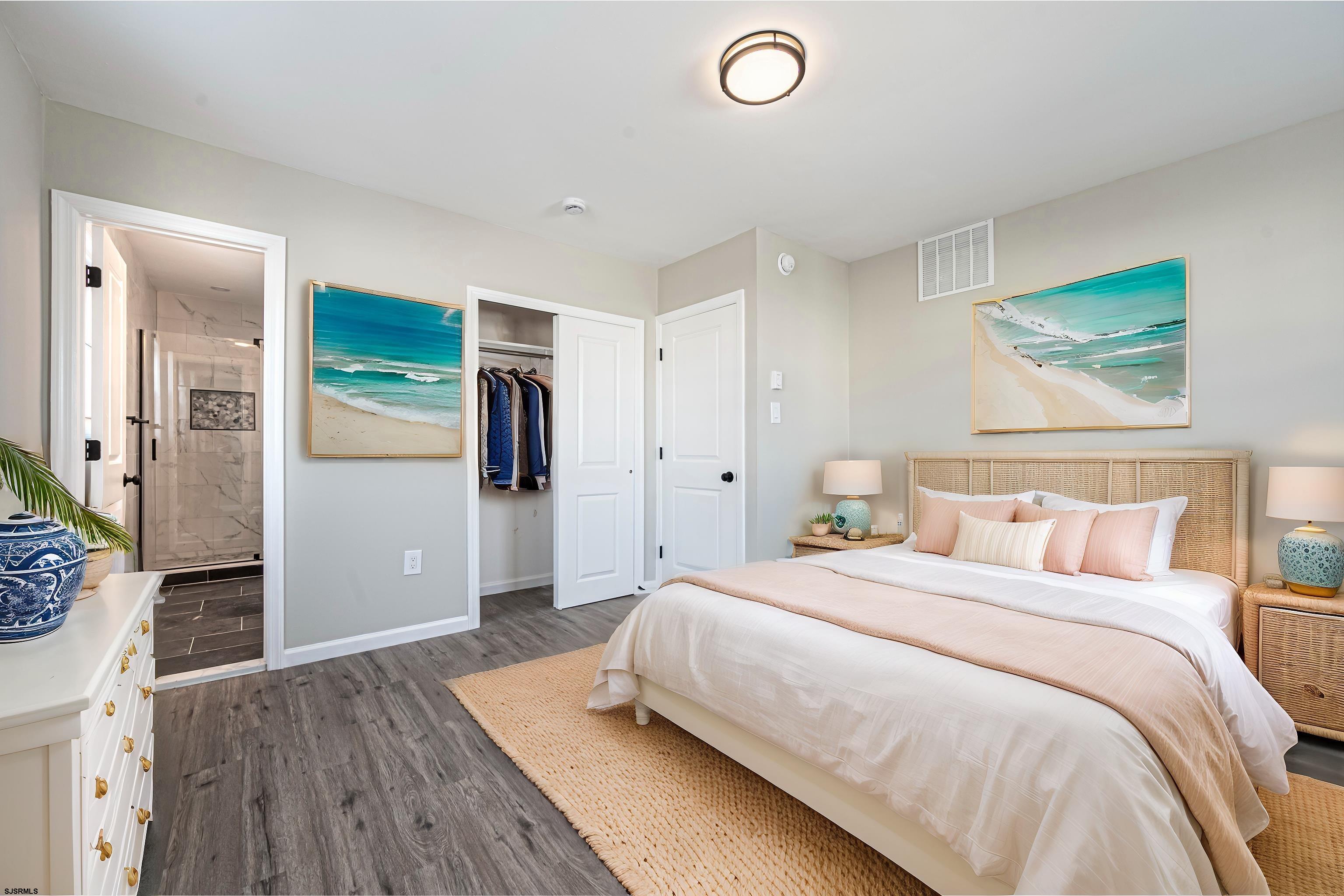 4617 Schooner Road, Unit A Brigantine, NJ 08203 - Photo 22 of 31 a bedroom with a bed and a painting on the wall