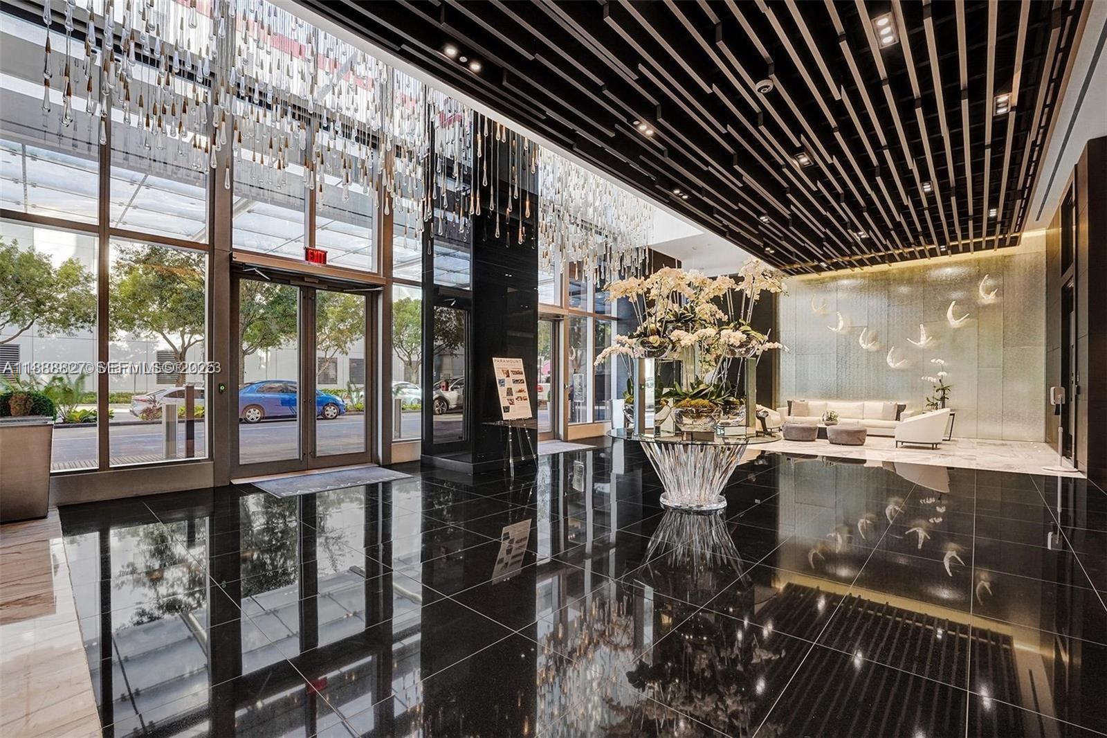 851 Northeast 1st Avenue, Unit 3601 Miami, FL 33132 - Photo 21 of 49 a view of a living room and balcony with furniture