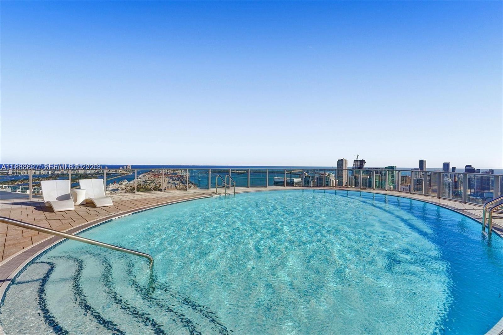 851 Northeast 1st Avenue, Unit 3601 Miami, FL 33132 - Photo 28 of 49 a view of a swimming pool and an outdoor seating