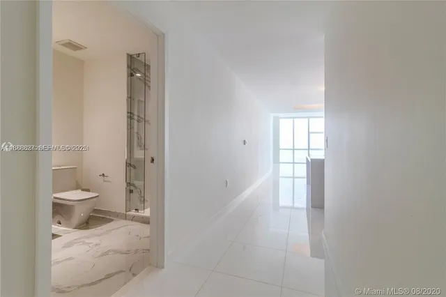 a bathroom with a toilet sink and shower