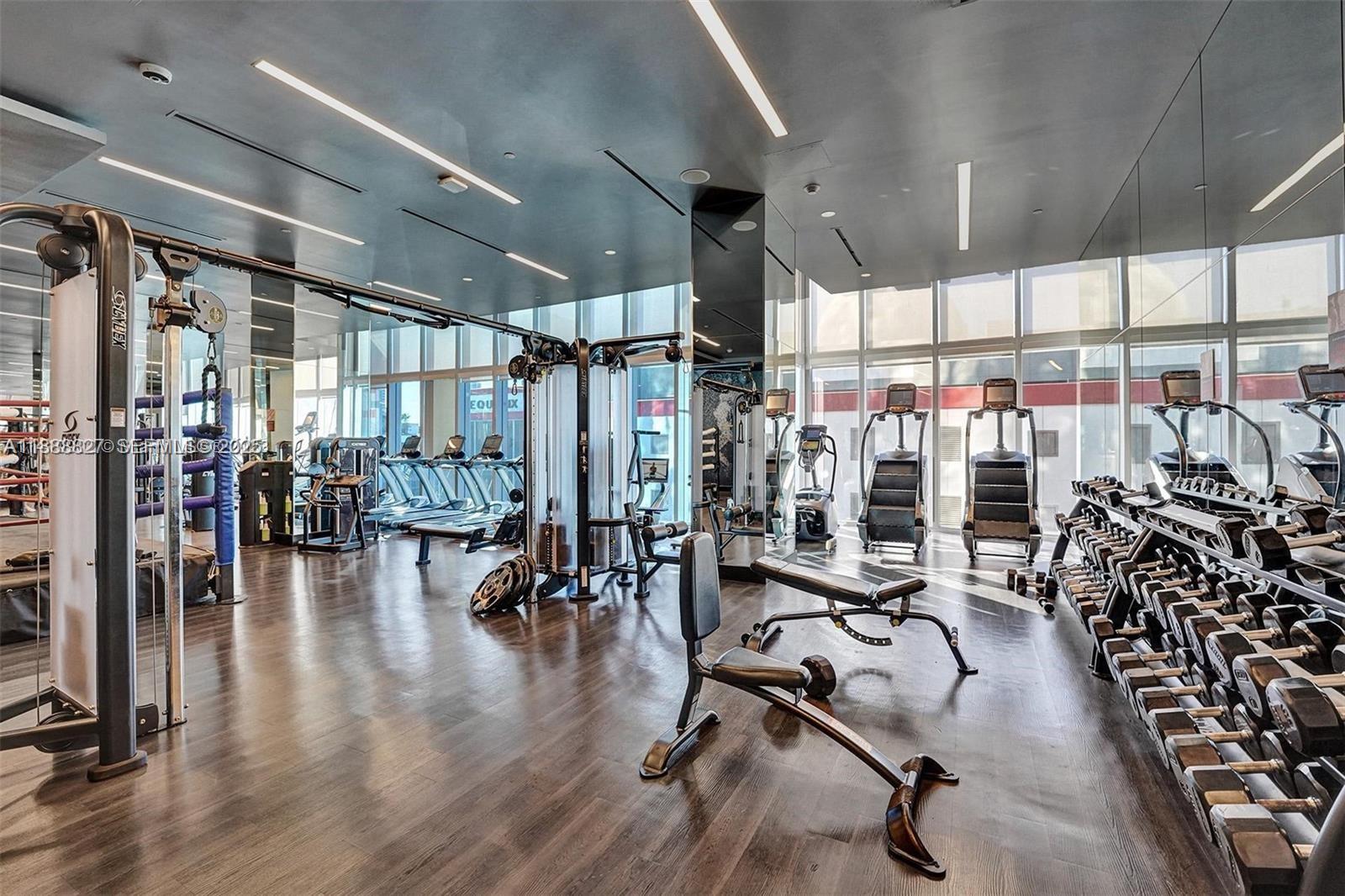 851 Northeast 1st Avenue, Unit 3601 Miami, FL 33132 - Photo 35 of 49 a view of a room with gym equipment