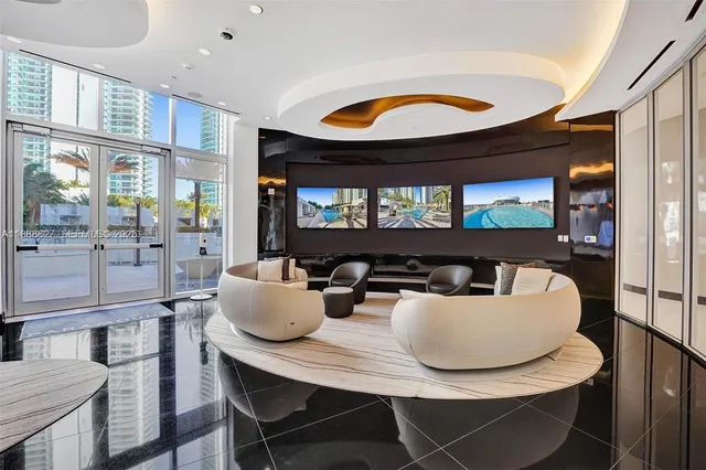 a dining room with furniture a large window and wooden floor