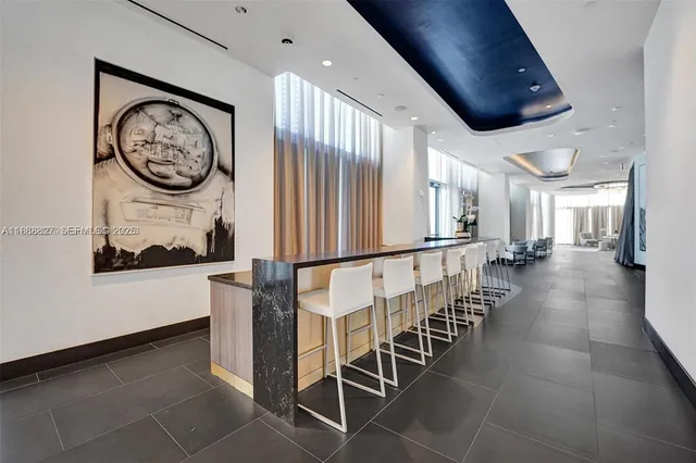 a view of a hallway with seating area