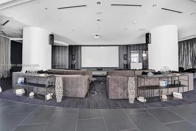 a room with lots of tables and chairs