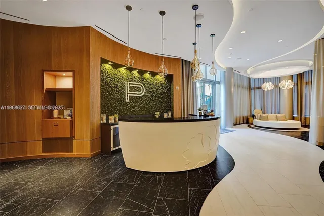 a view of a room with furniture and window