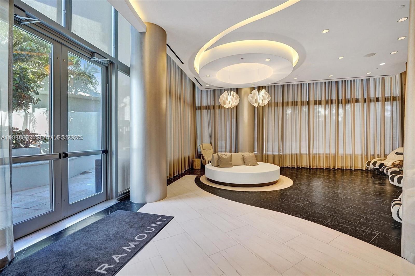 851 Northeast 1st Avenue, Unit 3601 Miami, FL 33132 - Photo 45 of 49 a bedroom with a bed and a large window