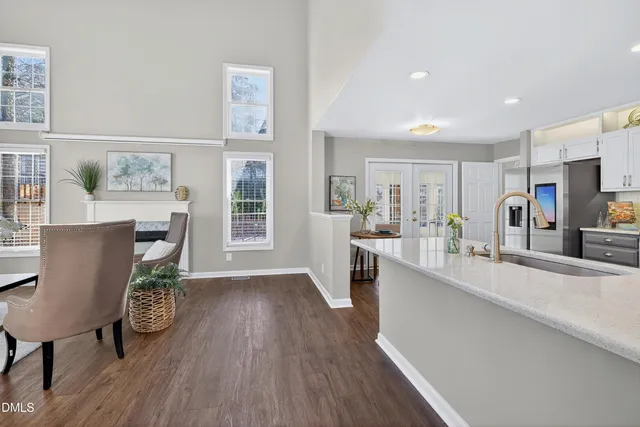 a dining room with furniture and wooden floor