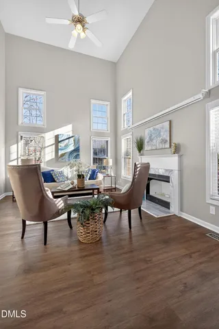 a large kitchen with stainless steel appliances granite countertop a large stove a sink dishwasher and a microwave oven with wooden floor