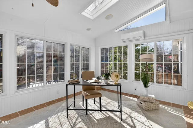 a white bath tub sitting next to a window