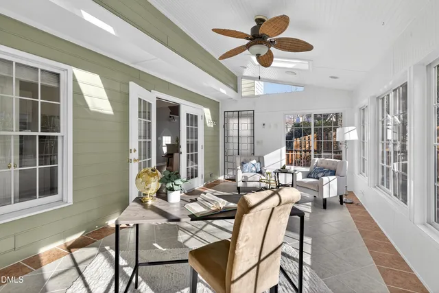 a spacious bathroom with a granite countertop sink mirror and bathtub