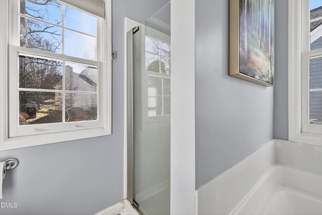 a view of a brick house with a large window