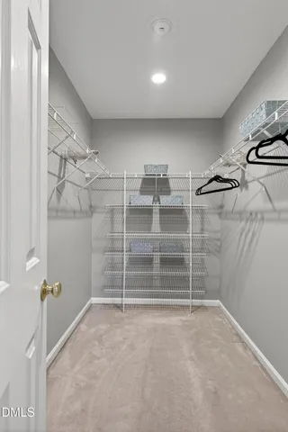 an aerial view of a house with a garden and swimming pool