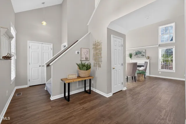 a view of entryway with wooden floor and stairs