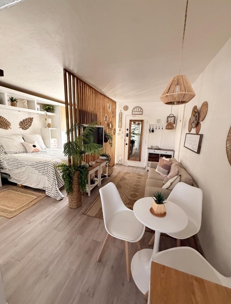 309 Crocus Terrace, Unit 9 Hollywood, FL 33019 - Photo 4 of 10 a living room with furniture and a table