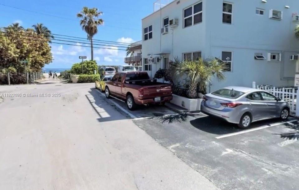 309 Crocus Terrace, Unit 9 Hollywood, FL 33019 - Photo 9 of 10 a car parked in front of a building