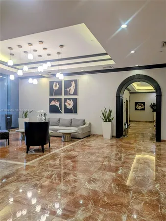 a view of a living room and entryway