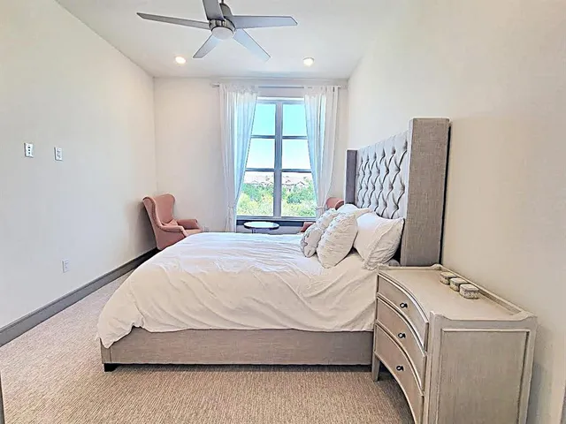 a bedroom with a bed and window