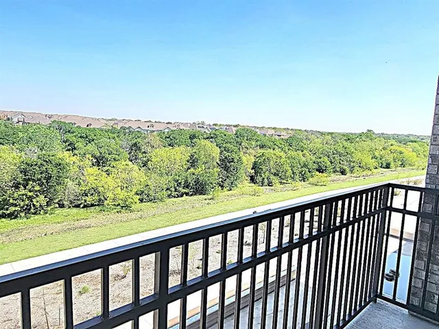 a view of balcony and yard