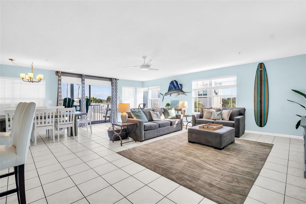 1802 Gulf Boulevard, Unit 12 Indian Rocks Beach, FL 33785 - Photo 14 of 41 a living room with furniture and a large window