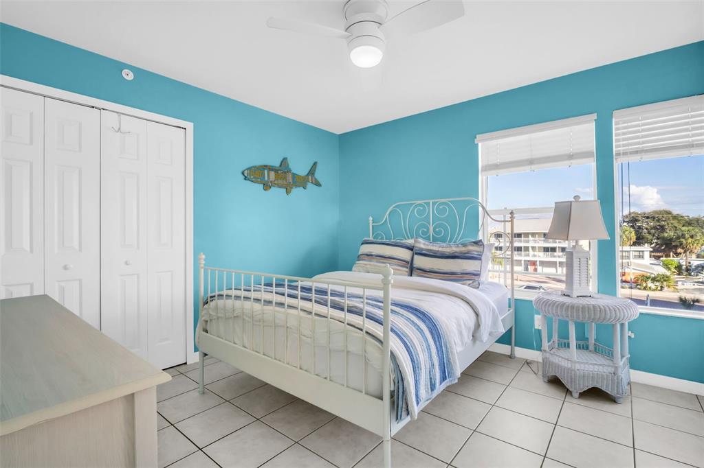 1802 Gulf Boulevard, Unit 12 Indian Rocks Beach, FL 33785 - Photo 19 of 41 a bedroom with a bed and a window
