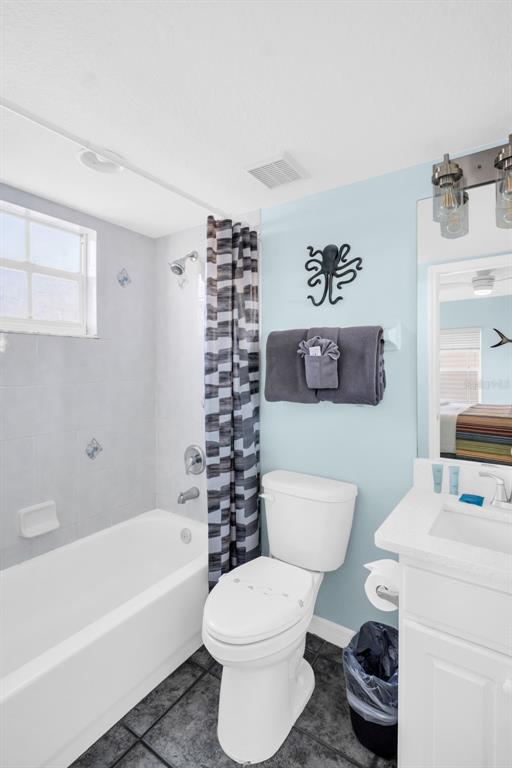 1802 Gulf Boulevard, Unit 12 Indian Rocks Beach, FL 33785 - Photo 23 of 41 a bathroom with a toilet a sink and a bathtub