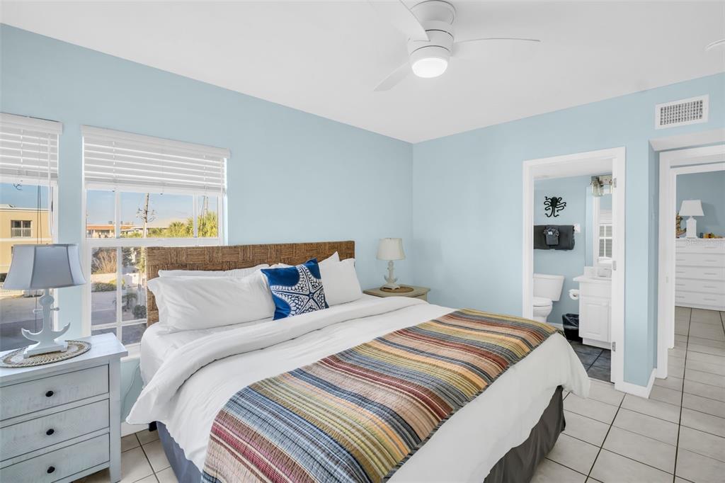 1802 Gulf Boulevard, Unit 12 Indian Rocks Beach, FL 33785 - Photo 26 of 41 a bedroom with a bed and window