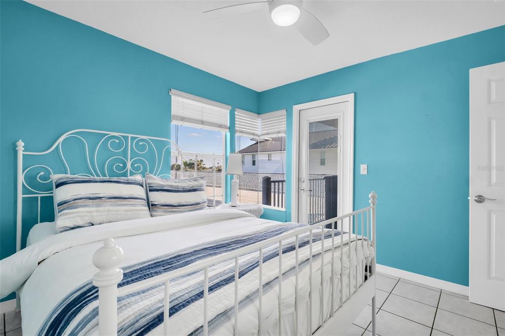 1802 Gulf Boulevard, Unit 12 Indian Rocks Beach, FL 33785 - Photo 33 of 41 a bedroom with a bed and a window