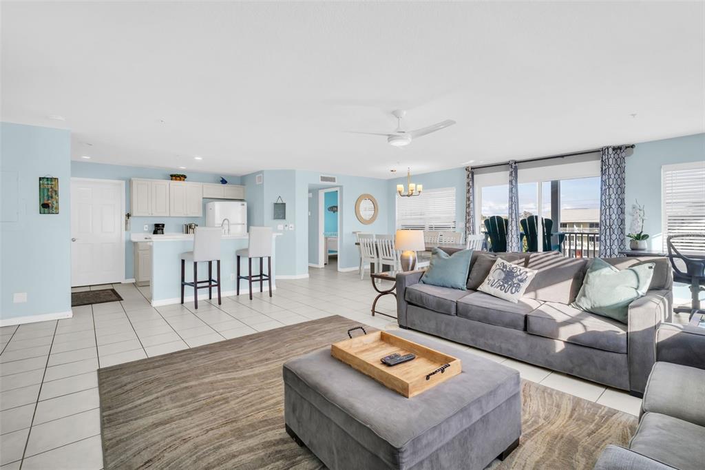 1802 Gulf Boulevard, Unit 12 Indian Rocks Beach, FL 33785 - Photo 9 of 41 a living room with furniture and wooden floor