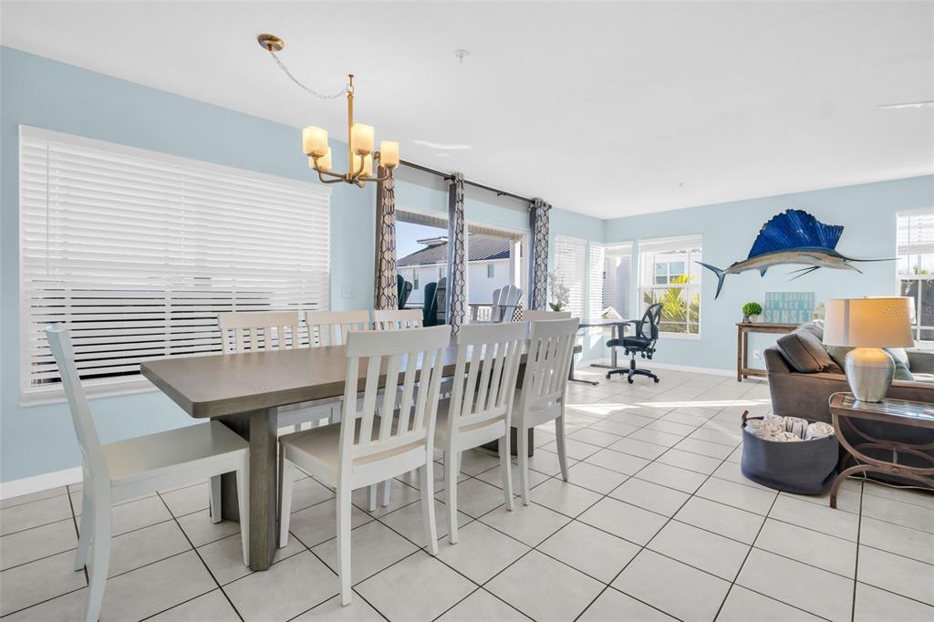1802 Gulf Boulevard, Unit 12 Indian Rocks Beach, FL 33785 - Photo 10 of 41 a dining room with furniture and wooden floor