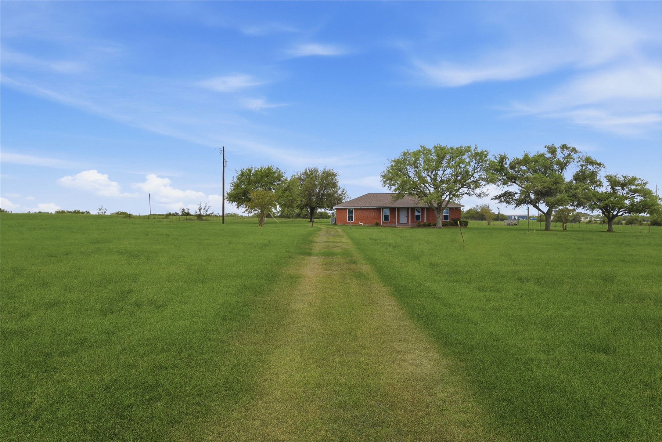 1250 Stockwell Damon, TX 77430 - Photo 11 of 50 Drive through front pastures from gate and cattle guard.