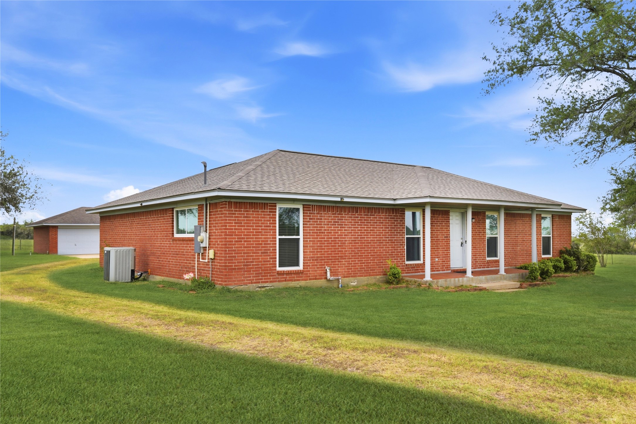 1250 Stockwell Damon, TX 77430 - Photo 2 of 50 a front view of house with yard and green space