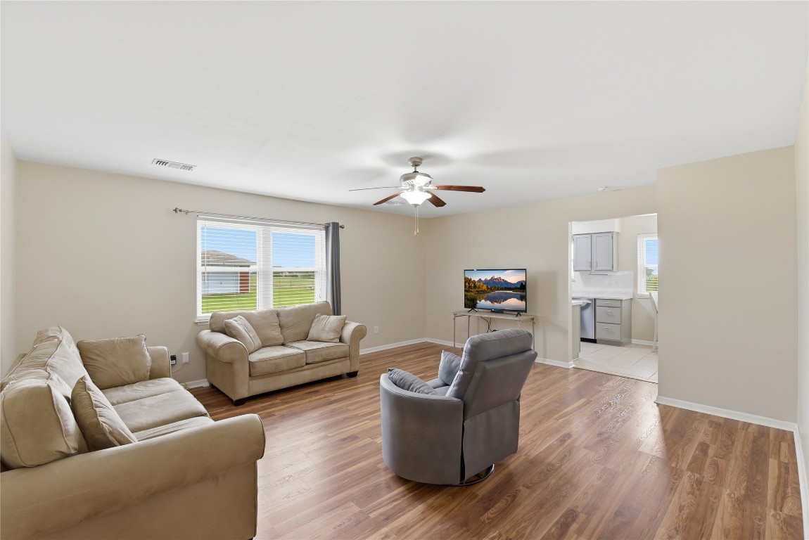 1250 Stockwell Damon, TX 77430 - Photo 27 of 50 a living room with furniture and a large window