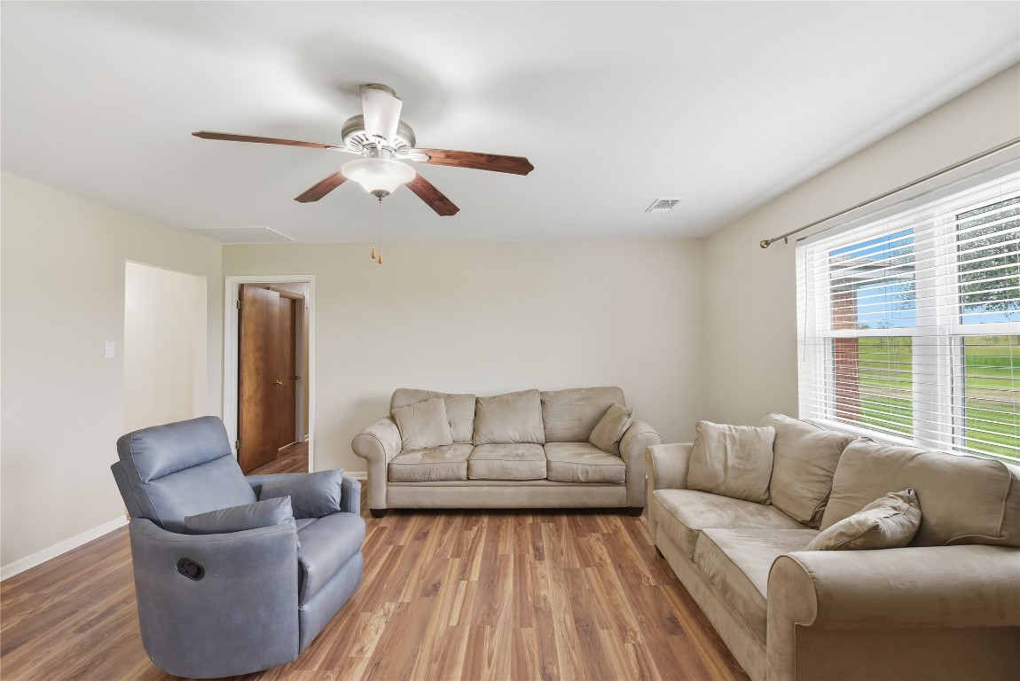 1250 Stockwell Damon, TX 77430 - Photo 29 of 50 a living room with furniture and a large window