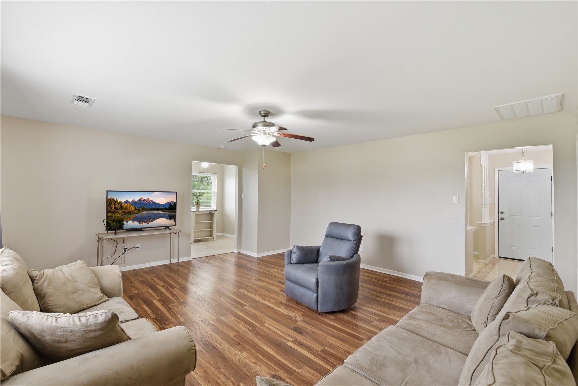 1250 Stockwell Damon, TX 77430 - Photo 30 of 50 a living room with furniture and a chandelier