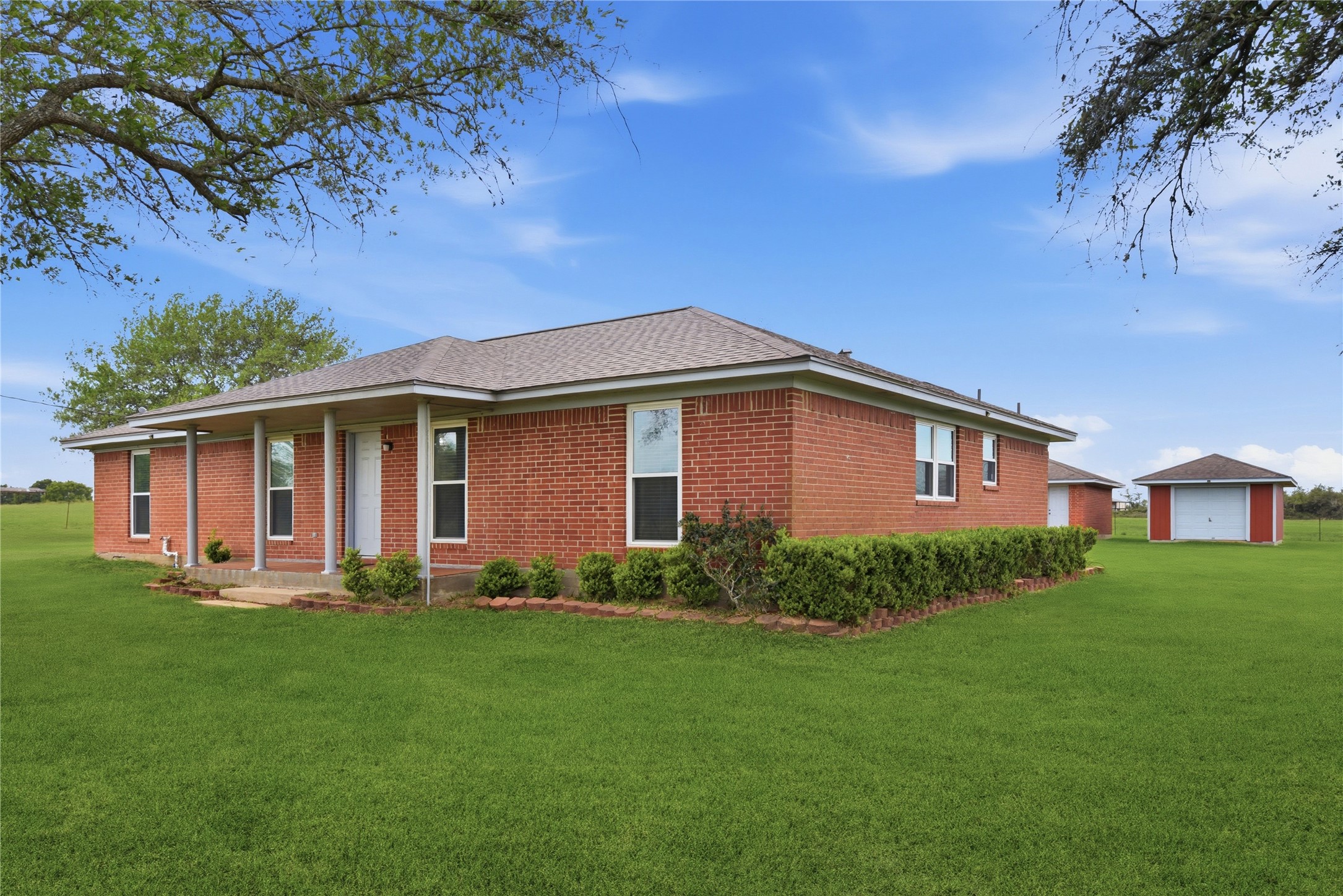1250 Stockwell Damon, TX 77430 - Photo 3 of 50 a front view of a house with garden