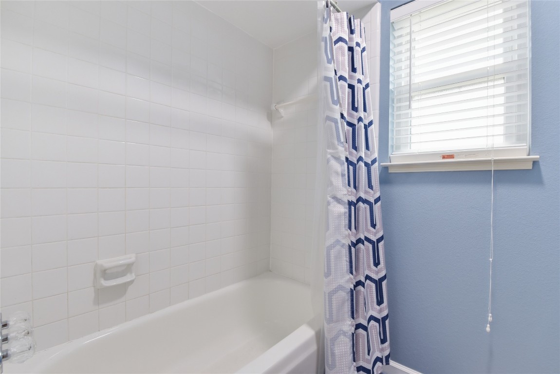 1250 Stockwell Damon, TX 77430 - Photo 45 of 50 a bathroom with a bathtub and shower