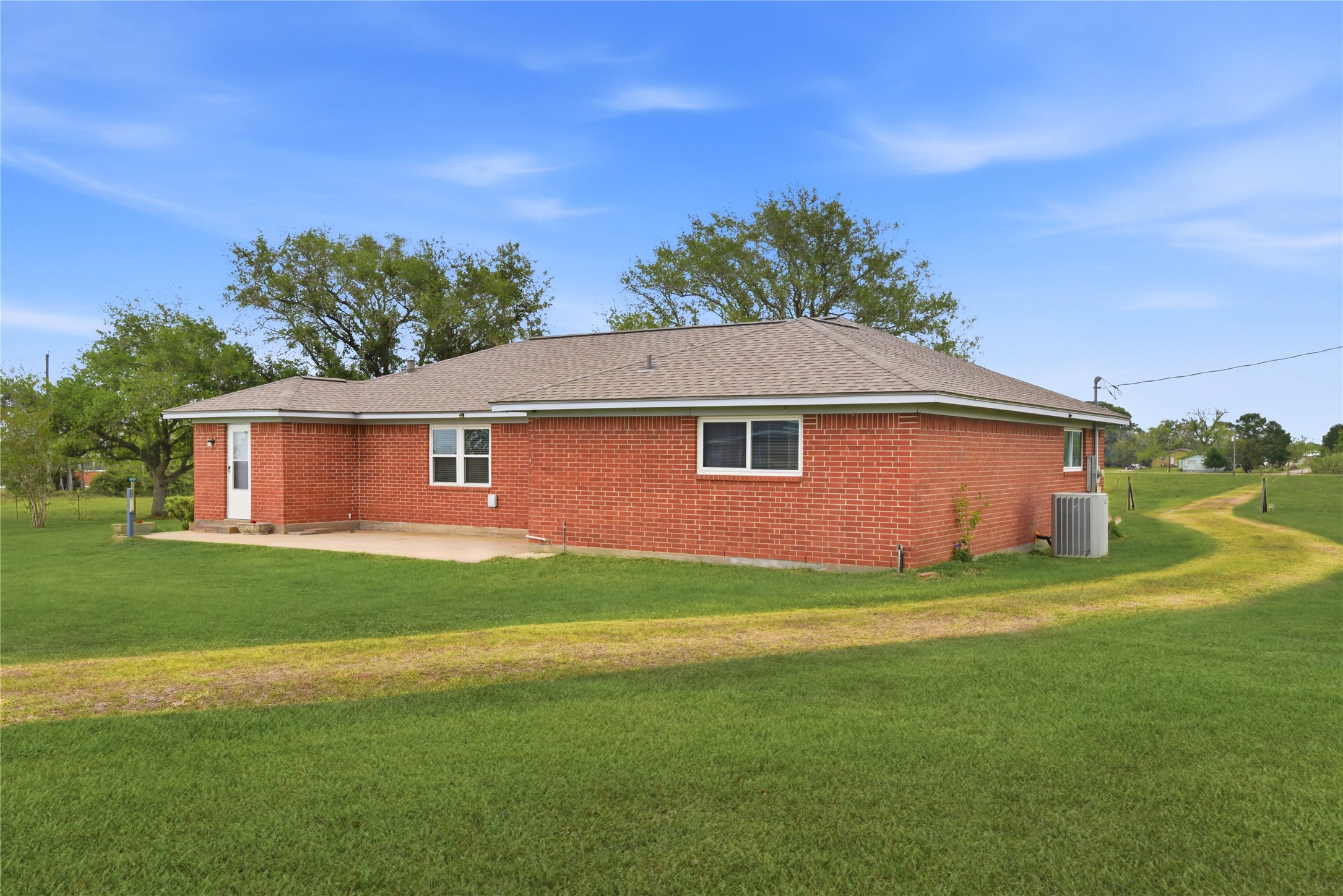 1250 Stockwell Damon, TX 77430 - Photo 5 of 50 a front view of a house with garden