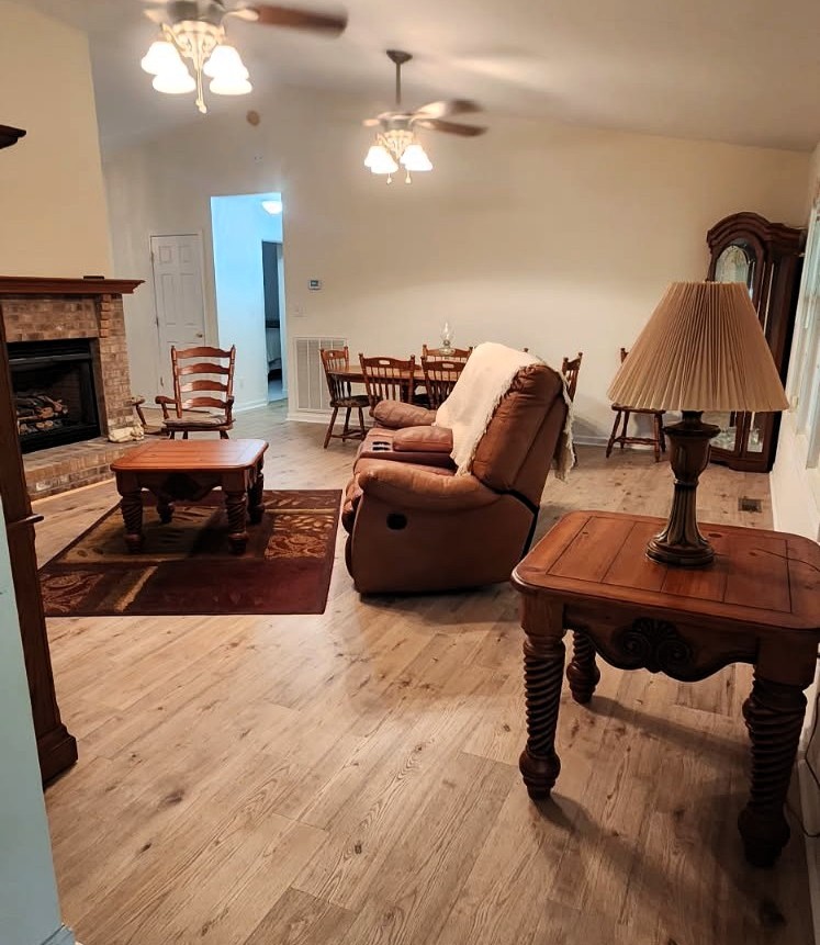 8202 State Highway 69 South Springville, TN 38256 - Photo 19 of 42 a living room with furniture and a fireplace