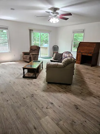 a living room with furniture and a large window