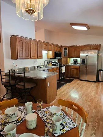 a kitchen with granite countertop a sink and a stove