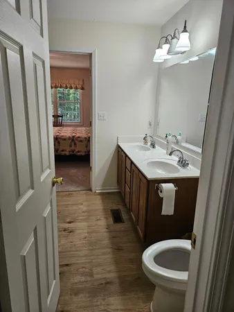 a en suite bathroom with a sink and a mirror