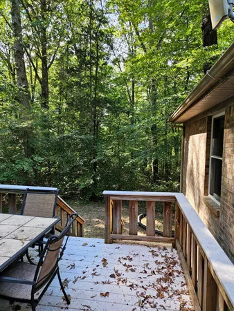 a front view of house with yard barbeque oven and outdoor seating