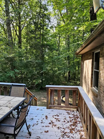 a front view of house with yard barbeque oven and outdoor seating