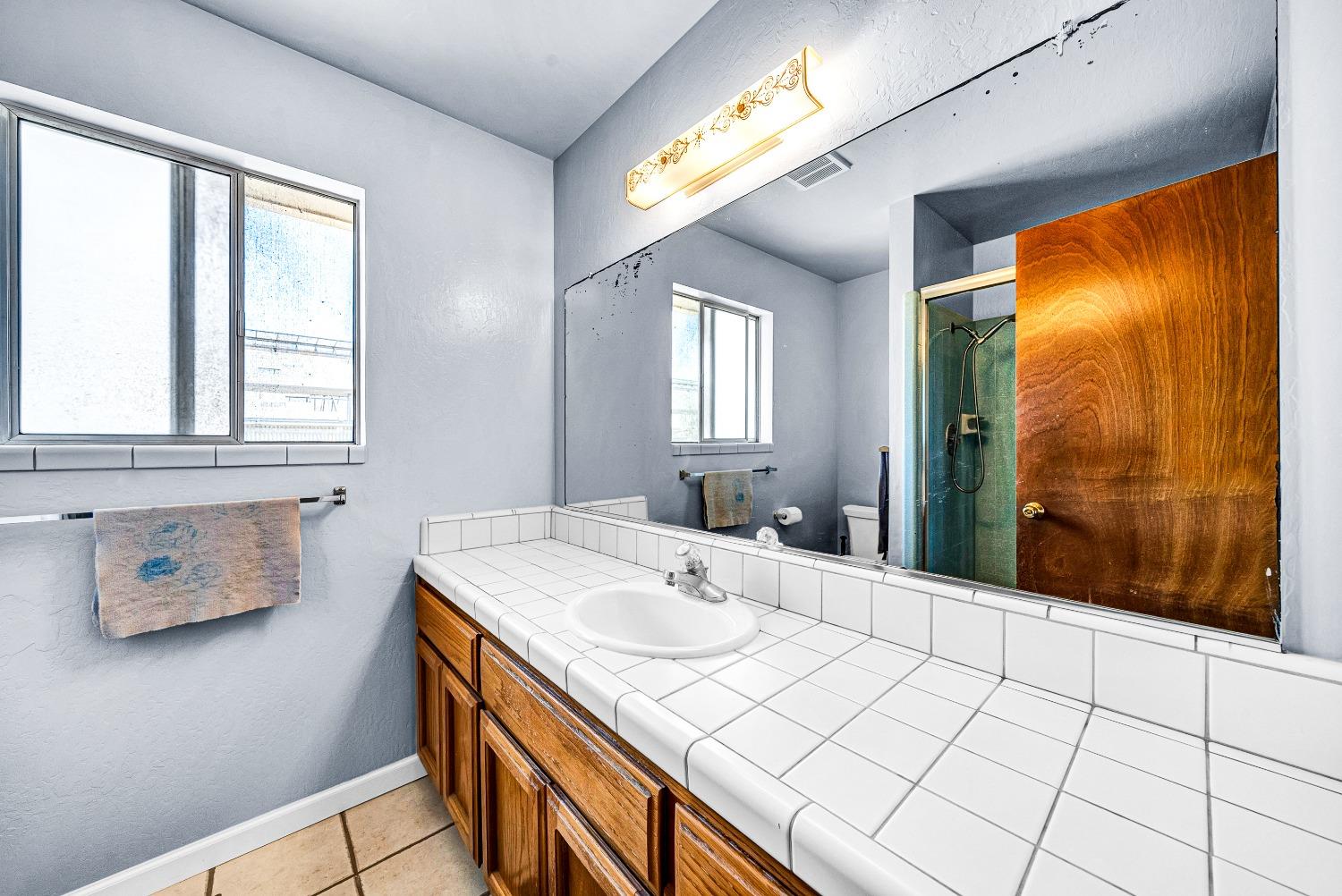 2 Lewis Watsonville, CA 95076 - Photo 17 of 92 a bathroom with a sink and a mirror
