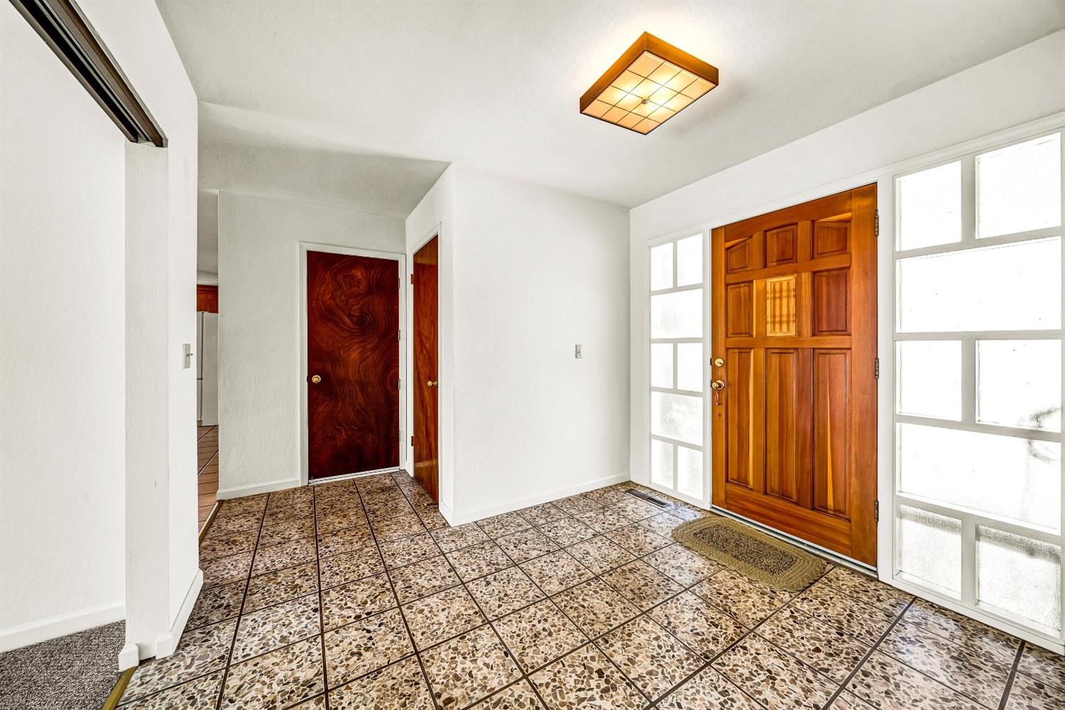 2 Lewis Watsonville, CA 95076 - Photo 20 of 92 a view of a hallway to a window with a rug