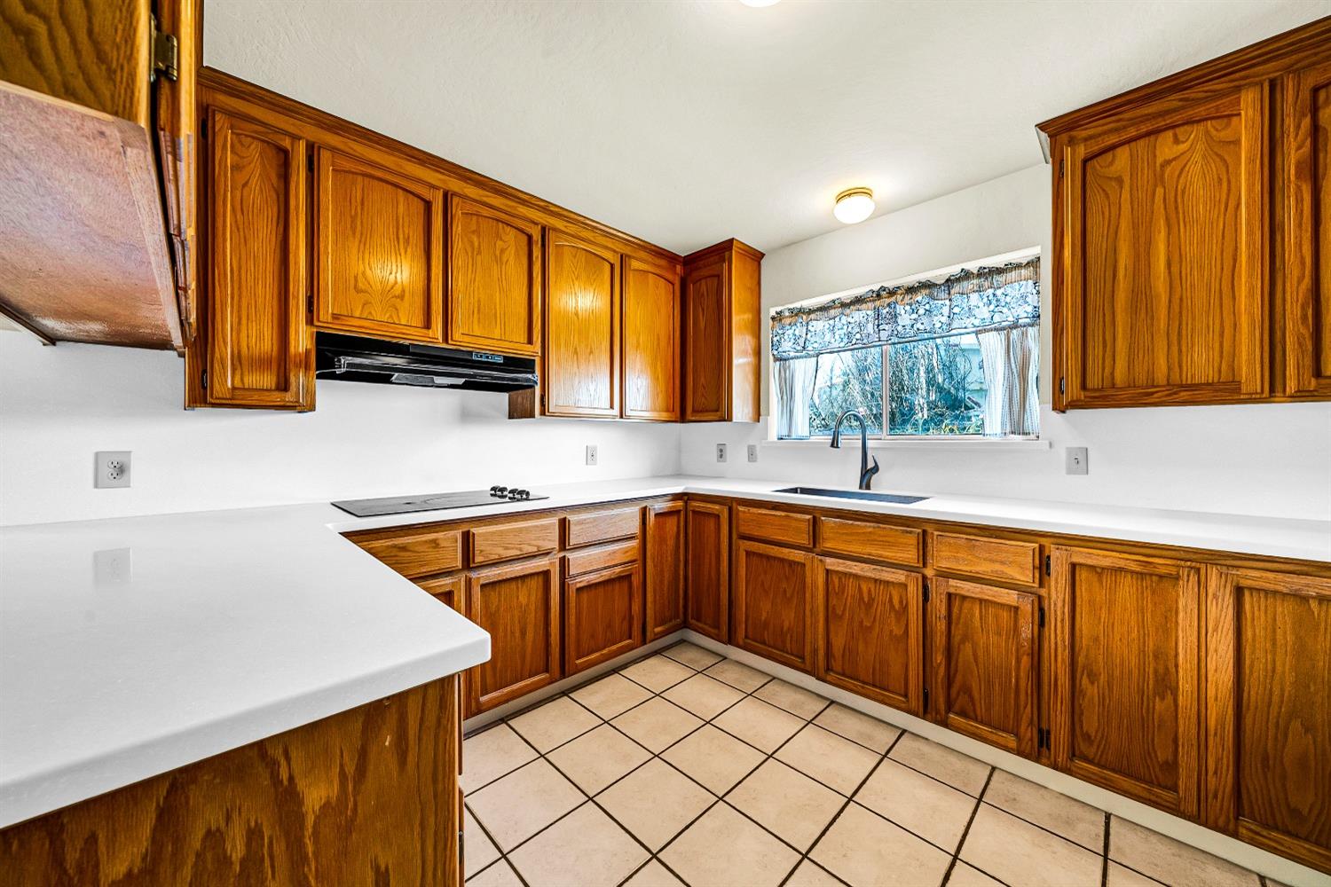 2 Lewis Watsonville, CA 95076 - Photo 24 of 92 a kitchen with stainless steel appliances granite countertop a sink and cabinets