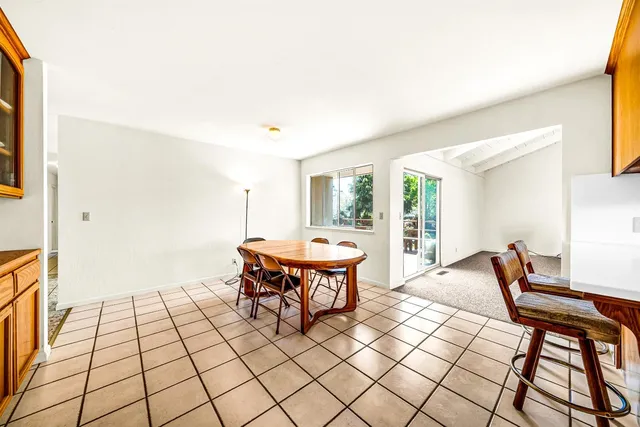 a view of a deck with wooden floor and seating space