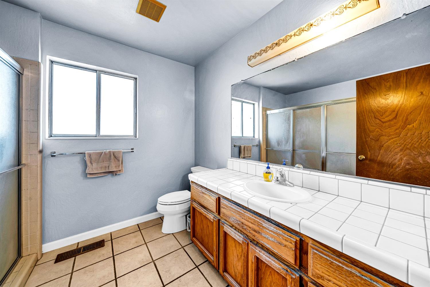 2 Lewis Watsonville, CA 95076 - Photo 50 of 92 a bathroom with a sink a toilet and mirror