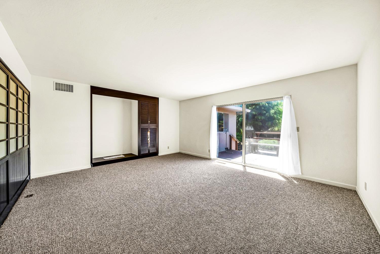 2 Lewis Watsonville, CA 95076 - Photo 9 of 92 a view of a big room with windows and chandelier fan